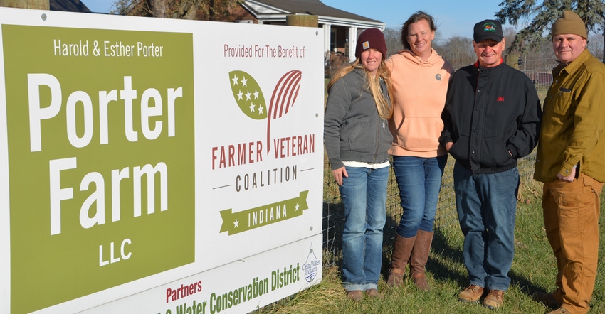 Bree Ollier, Sara Creech, Steve Stamper and Joe Ricker standing next to Porter Farm sign