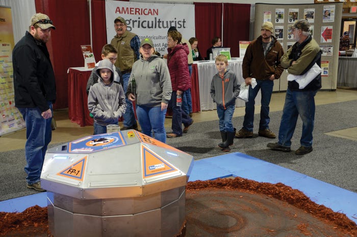 Visitors at the New York Farm Show check out the BouMatic and American Agriculturist booths