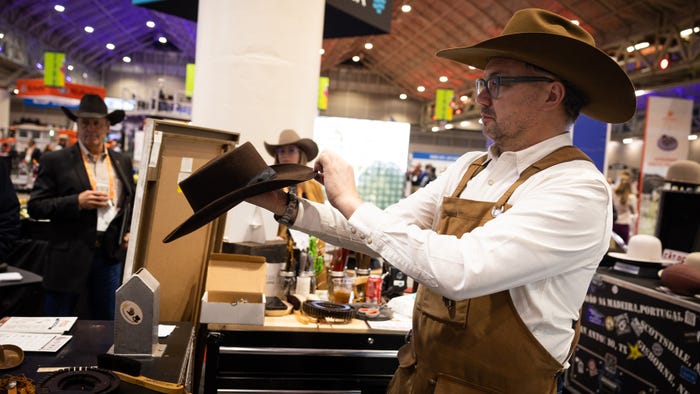 Trent Johnson of Greeley Hat Works shown shaping a custom hat at the 2023 National Cattlemen’s Beef Association Trade Show