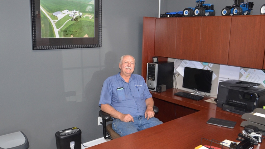 Randy Kron, president of Indiana Farm Bureau, sits behind a desk
