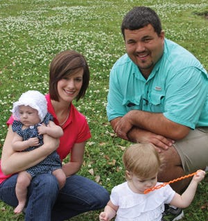 LOUISIANA RICE FARMER John Compton, wife Brianne, daughters Ava and baby Kathryn.