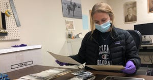 History Nebraska intern, Nebraska Wesleyan student, Annie Johnson, is sorting through hundreds of prints, slides and transpar