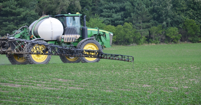 sprayer in soybean field
