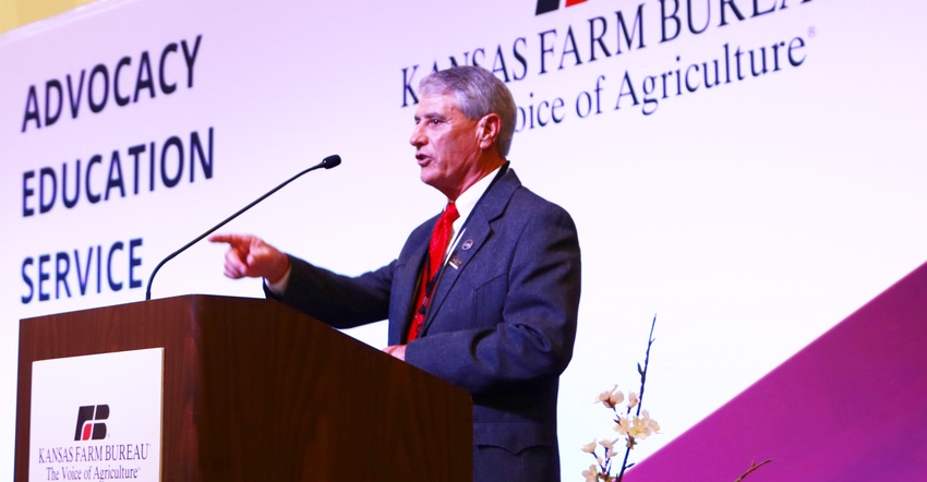  Newly elected Kansas Farm Bureau President Joe Newland, of Wilson County, Kan., at podium