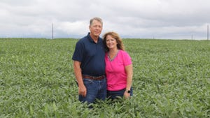 Mark and Marcia Knudson in field