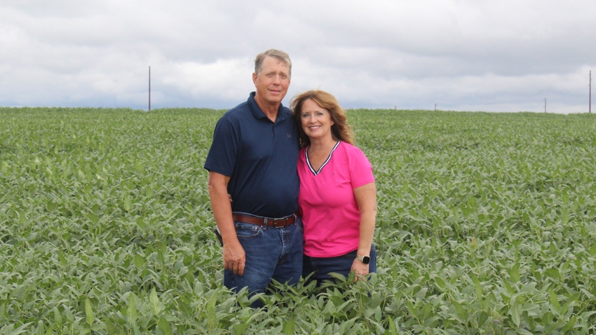 Mark and Marcia Knudson in field