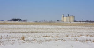 Grain Elevator In Winter behind field