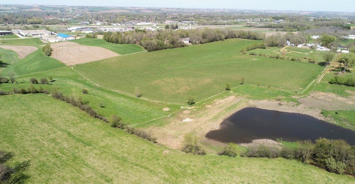 Stormwater sits behind a flood-control berm in May 2022 on the Johnmeyer farm overlooking the City of Zumbrota