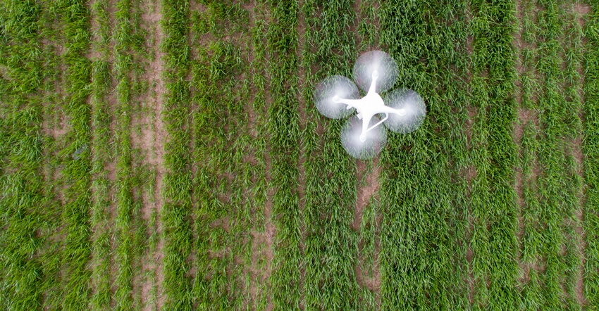 drone flying above field