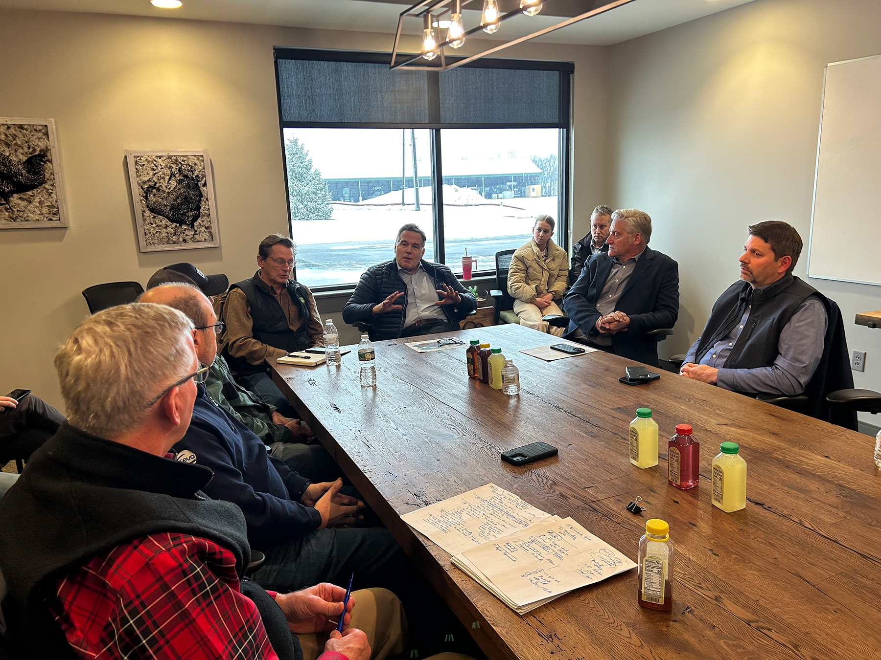 Chris Torres - Pennsylvania Senator Dave McCormick at a table with poultry growers