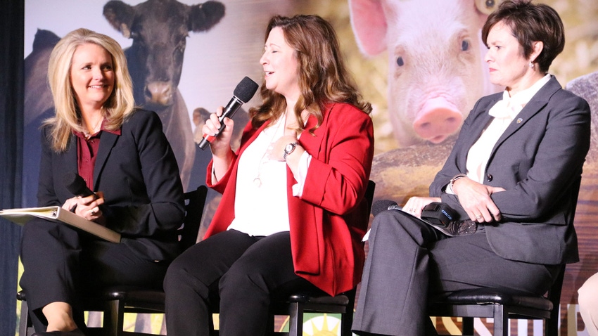 Chris Chinn, Missouri Director of Agriculture, on a stage with two other women