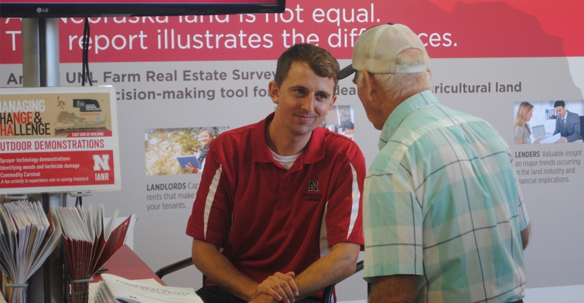  Jim Jansen, visits with farmers at the Husker Harvest Days