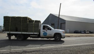 Flatbed truck hauling hay