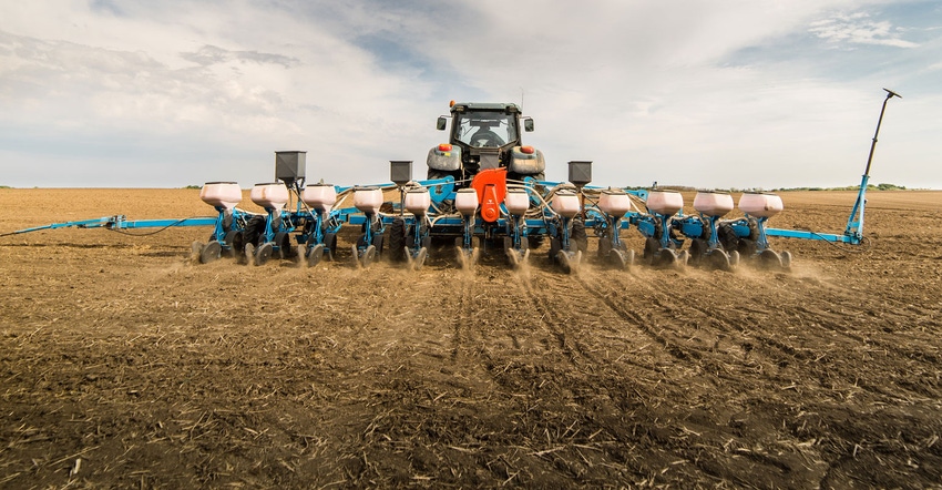 Planter at work in a no-till field Planter at work in a no-till field