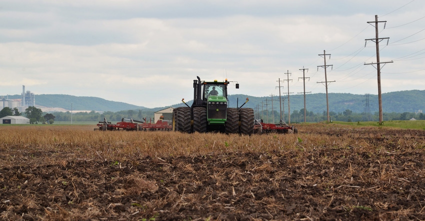Tractor tillaging a field