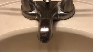 A close-up of a sink faucet