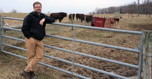 Bret Margraf standing by a fence on his farm in McCutchenville, Ohio