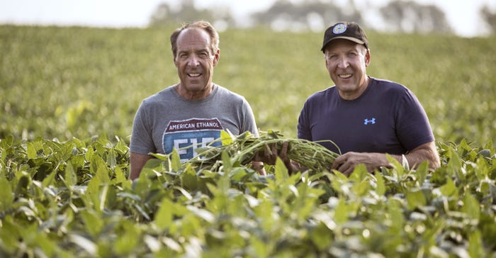 Craig (left) and Gene Stehly check their soybean crop