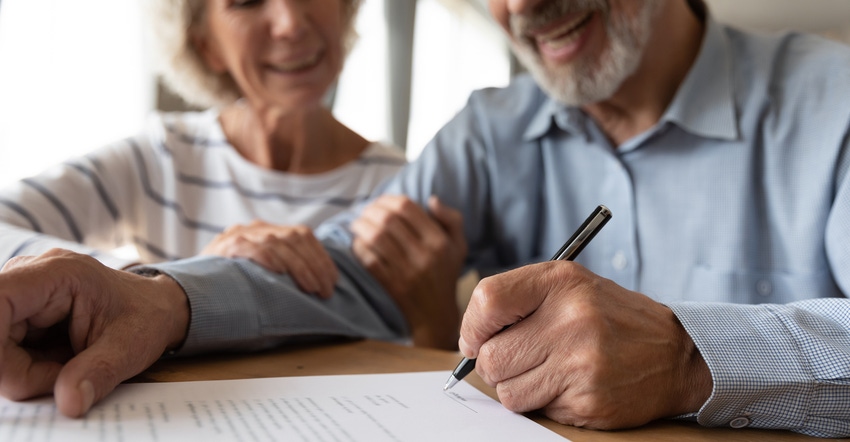 Old couple make agreement sign insurance contract