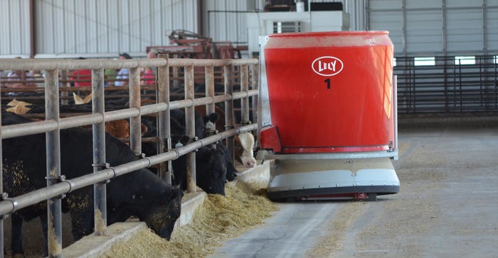 Lely Vector mixing and feeding robots traveling the feeding line of cattle