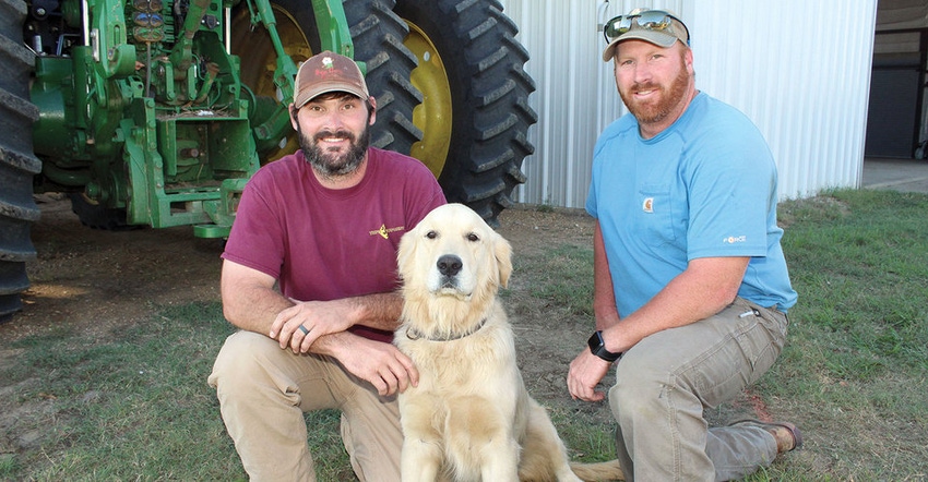 Huerkamp Farm's Brandon Huerkamp, left, Tyler Huerkamp, and their dog Knox
