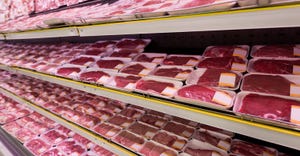 Packages of meat in gorcery store isle