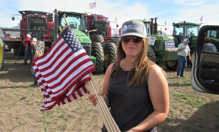 Laura Schaad holding flags