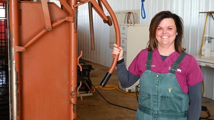 woman next to squeeze chute