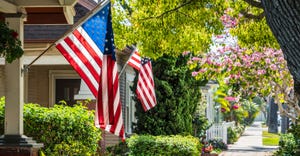 American flags hanging on a houses 