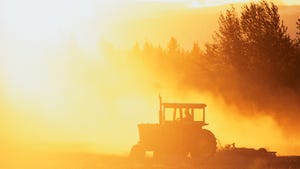tractor in sunset