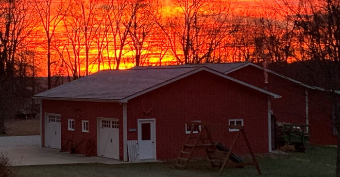 sunrise over red barn