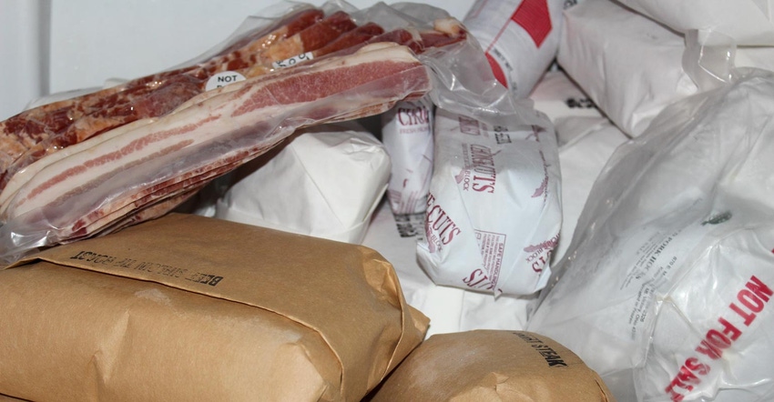 A variety of packaged frozen meat wrapped in plastic or paper