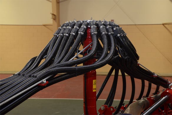 Both towers are engineered to allow material to come out the top through the center of the tower, rather than on the outside. Then, the hoses from the towers to the openers are positioned to minimize angles, giving product a straight shot to the opener.