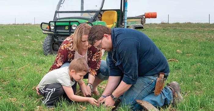 Michael and Mary Beth Jackson dig up dirt with their son Mack