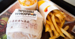 In this photo illustration, an 'Impossible Whopper' sits on a table at a Burger King restaurant on April 1, 2019, in Richmond