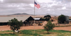 American Flag flies in the middle of a dairy farm located outside of Johannesburg, South Africa