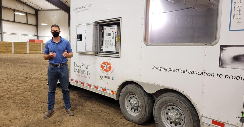 Brett Ramirez with ISU's 24-foot mobile Swine Ventilation Trailer