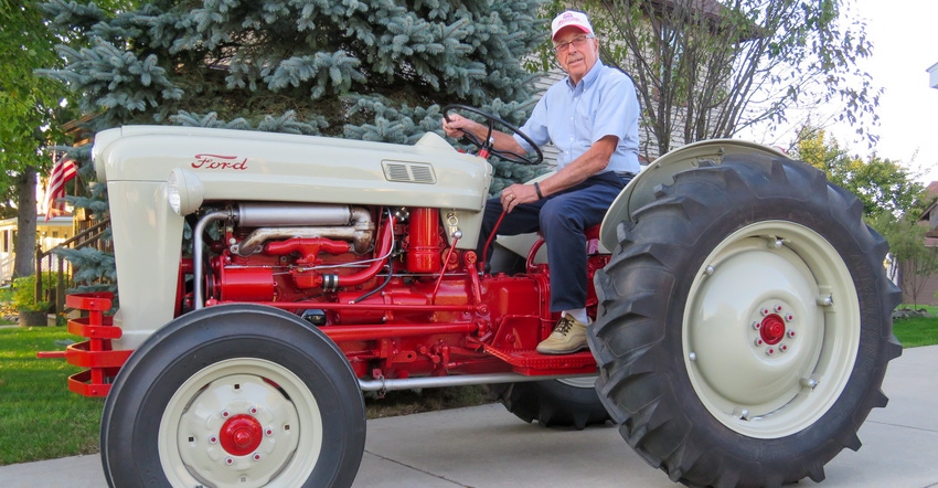 Franklin Wolter sitting on a 1953 Ford NAA Golden Jubilee tractor