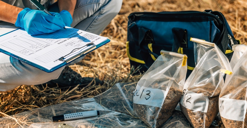 emale agronomist taking notes in the field