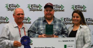 Jason Herrington ,the Grand Champion Forage Producer  with Claude Fortin of Brevant Seeds and Herrington’s fiancée Anissa 