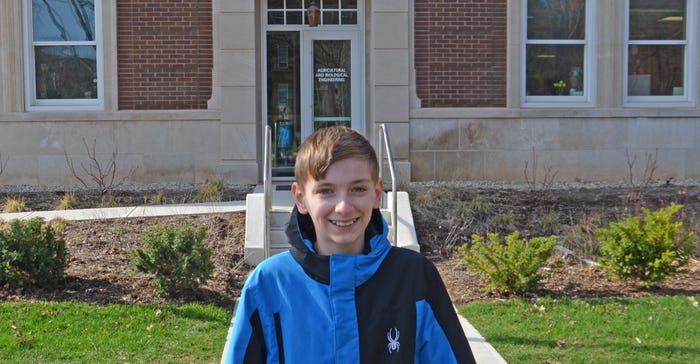 12-year-old Graham Curtis stands in front of Purdue's new Ag & Biological Engineering Building