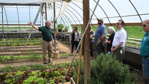 Duke Gastiger leads a tour of his Windswept Farm greenhouse near State College