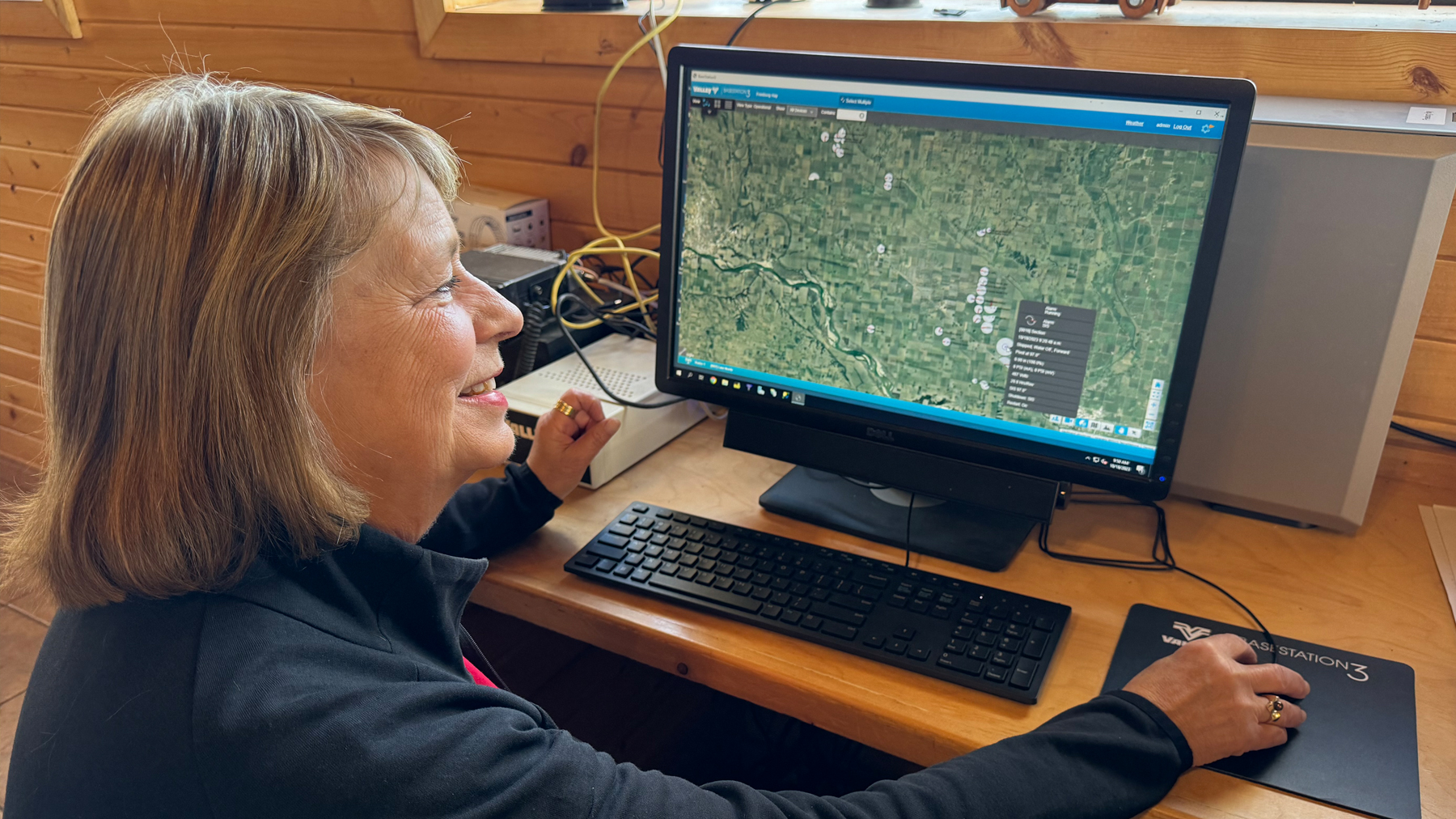 Amy monitoring all of the pivots and their operations from their main office computer