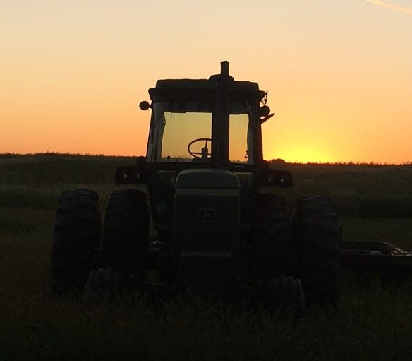 tractor silhouette at sunset