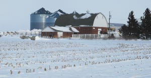 barn  and snowy farm fields