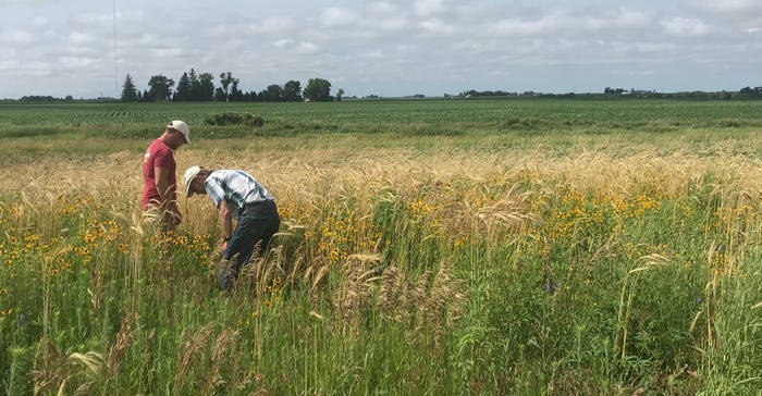 Conservation specialist Tim Youngquist and farmer Lee Tesdell 