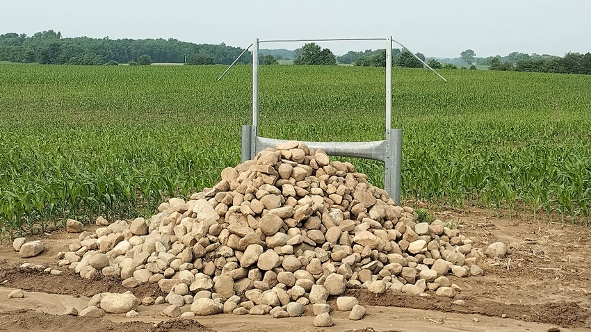 Pile of rocks next to a field