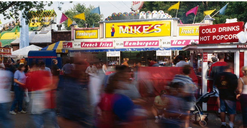 Food stands and people at county fair