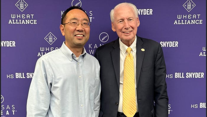 Guorong Zhang and former K-State head football coach Bill Snyder