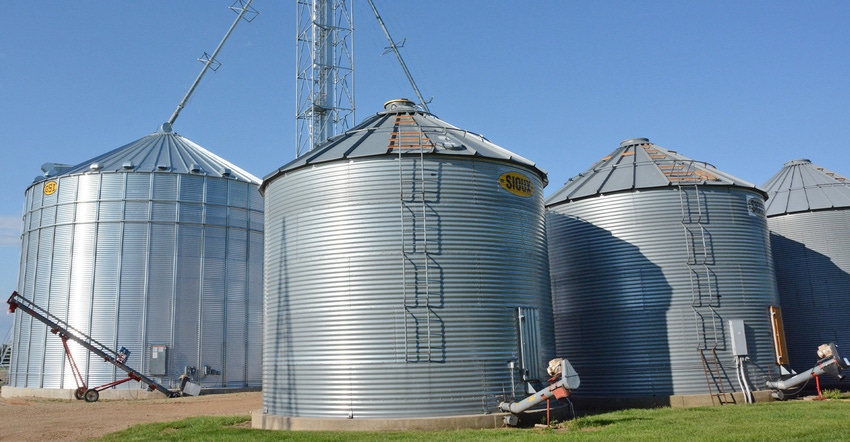 row of steel grain bins